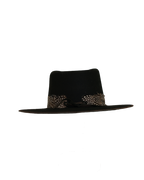 Back view of a black teardrop crown fedora with a speckled black and white feather hat band and burnt brim edge
