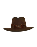 Front view of a dark brown wide-brim fedora with an teardrop crown crease and layered rust-tone feather hat band.
