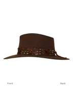Side profile view from front to back of a dark brown wide-brim fedora with an teardrop crown crease and layered rust-tone feather hat band.
