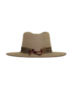 Back view of a greenish tan wide-brim fedora with a teardrop crown crease and, multicolored neutral feather hat band.

